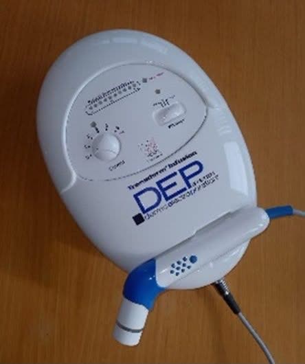 The DEP DermoElectroPoration transdermal-infusion device with its needle-free applicator handpiece — Nue Skin Beauty Esthetique